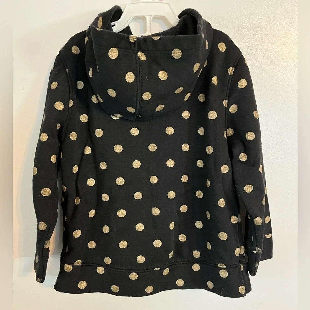 Girl’s Old Navy zip-up hoodie, black with gold polka dots, size 4t.